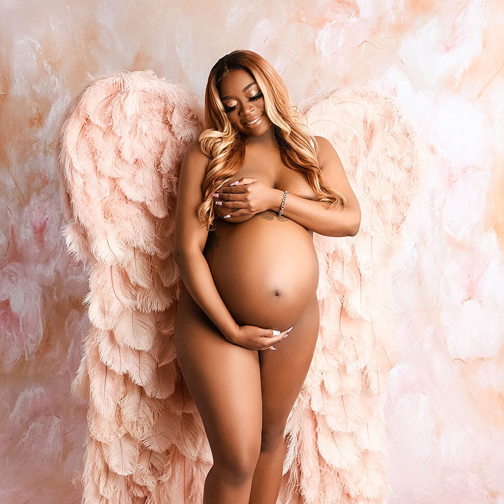 Maternity Photograph of Woman Wearing Angel Wings byDallas/Fort Worth Maternity Photographer Chaunva LeCompte Photography